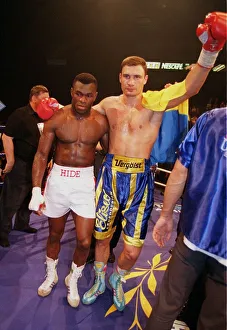 Vitali klitschko with arm around Herbie Hide after knocking him out in two rounds to take Vitali klitschko with arm around Herbie Hide after knocking him out in two rounds to take