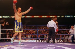 Vitali klitschko with arms in the air after knocking out britians Herbie Hide in two Vitali klitschko with arms in the air after knocking out britians Herbie Hide in two