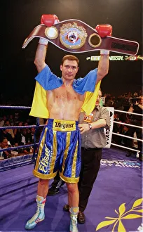 Vitali klitschko holding up the WBO world heavyweight belt after knocking out britians Vitali klitschko holding up the WBO world heavyweight belt after knocking out britians
