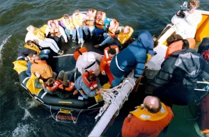 Volunteers clamber into the new life raft during a mock evacuation of the cross Tyne Volunteers clamber into the new life raft during a mock evacuation of the cross Tyne