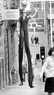 Walking Tall! World champion stilt walker John Long set some heads turning when he went Walking Tall! World champion stilt walker John Long set some heads turning when he went