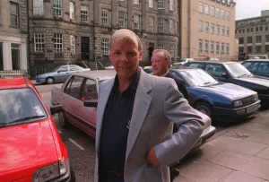 Wallace Mercer former Hearts football chairman standing in street Wallace Mercer former Hearts football chairman standing in street