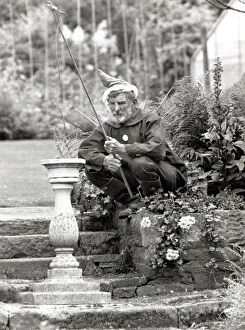 Images Dated 3rd July 1988: Walter Sherratt, aged 67, is posing as a garden gnome in his garden at Biddulph