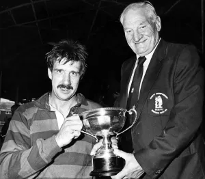 Warwickshire RFU President Harry Walker presents the Country Championship trophy to Warwickshire RFU President Harry Walker presents the Country Championship trophy to