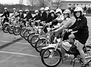 Twelve Warwickshire schools receive a moped for their respective schools as part of a Twelve Warwickshire schools receive a moped for their respective schools as part of a