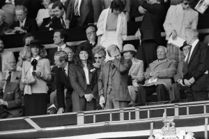 Watford chairman Elton John sheds a tear. His new wife Renate soaks up the atmosphere Watford chairman Elton John sheds a tear. His new wife Renate soaks up the atmosphere