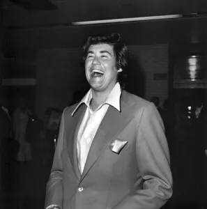 Wayne Newton looking very happy on his arrival at Heathrow Airport Wayne Newton looking very happy on his arrival at Heathrow Airport