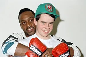 Former WBO middleweight champion Nigel Benn with boxer Richard Ross. 6th March 1990 Former WBO middleweight champion Nigel Benn with boxer Richard Ross. 6th March 1990