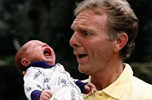 Former West Ham and England footballer Bobby Moore with his first grandchild Poppy Former West Ham and England footballer Bobby Moore with his first grandchild Poppy