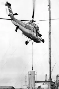 A Westland Wessex helicopter, operated by Bristow, tackles the job of airlifting the tip A Westland Wessex helicopter, operated by Bristow, tackles the job of airlifting the tip