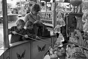 The Whitsun Fair at Hearsall Common, Coventry. These two children try their luck hooking The Whitsun Fair at Hearsall Common, Coventry. These two children try their luck hooking