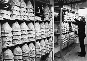 A wide selection of different sized helmets at the Mid Anglia police Headquarters, 1973 A wide selection of different sized helmets at the Mid Anglia police Headquarters, 1973