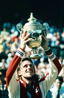 Wimbledon 1977. Bjorn Borg holds up the trophy after winning the men' Wimbledon 1977. Bjorn Borg holds up the trophy after winning the men'