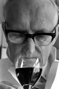 Wine Taster sampling the latest consignment of red wine from the Beaujolais region of Wine Taster sampling the latest consignment of red wine from the Beaujolais region of