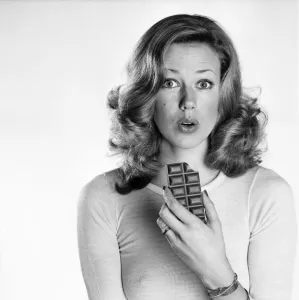 Woman eating chocolate. February 1975 75-00891 Woman eating chocolate. February 1975 75-00891