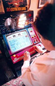 A woman playing on a one armed bandit or electronic gaming machine in November 1999 A woman playing on a one armed bandit or electronic gaming machine in November 1999