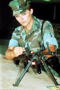 A woman soldier in the US army demonstrates a light machine gun at a daily press A woman soldier in the US army demonstrates a light machine gun at a daily press