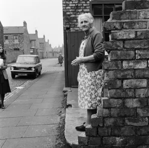 A woman standing in the street in Middlesbrough. 1971 A woman standing in the street in Middlesbrough. 1971