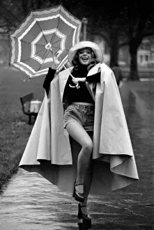 Images Dated 28th January 1975: Woman / Umbrella / Humour: Actress Cheryl Gilham. January 1975 75-00534-002