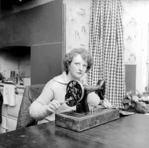 Woman using sewing machine. Circa 1964 A1137b-002 Woman using sewing machine. Circa 1964 A1137b-002