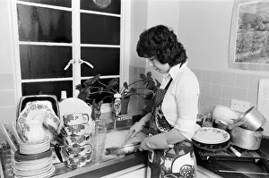 A woman washing up - one of the many daily chores of a housewife. 26th January 1979 A woman washing up - one of the many daily chores of a housewife. 26th January 1979