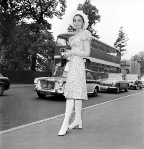 Woman wearing floral patterned knee length dress with hat on the first day of Royal Woman wearing floral patterned knee length dress with hat on the first day of Royal