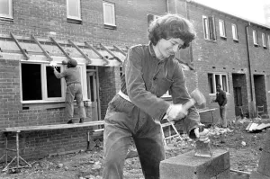 Women bricklayer working on construction site. February 1987 Women bricklayer working on construction site. February 1987