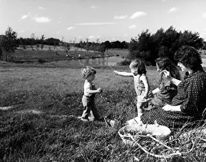 Women and children in Runcorn town park. Runcorn is within the borough of Halton in Women and children in Runcorn town park. Runcorn is within the borough of Halton in