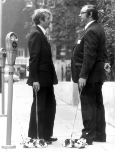 Wooden Snoopy Dogs on leads being demonstrated by Managing Directors of the firm that Wooden Snoopy Dogs on leads being demonstrated by Managing Directors of the firm that