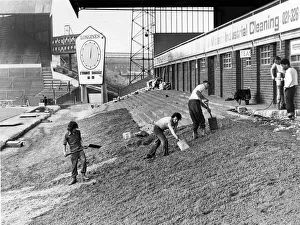 Workmen are busy preparing the ground before beginning work on the Railway End stand Workmen are busy preparing the ground before beginning work on the Railway End stand