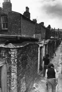 Workmen making general improvements to the narrow back passageways of a street in Everton Workmen making general improvements to the narrow back passageways of a street in Everton