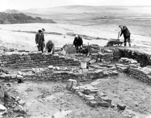 Workmen repair and tidy the remains of the Roman fort at Housesteads in Northumberland in Workmen repair and tidy the remains of the Roman fort at Housesteads in Northumberland in
