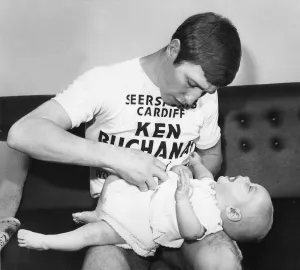 World Lightweight Champion Ken Buchanan seen here tending to his young son Mark during a World Lightweight Champion Ken Buchanan seen here tending to his young son Mark during a