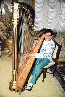 World snooker champion Joe Johnson poses in London, playing a harp. 28th May 1986 World snooker champion Joe Johnson poses in London, playing a harp. 28th May 1986