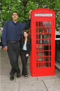Worlds tallest man Radhouane Charib in London May 1999 at 7ft 9inches with Mirror Worlds tallest man Radhouane Charib in London May 1999 at 7ft 9inches with Mirror