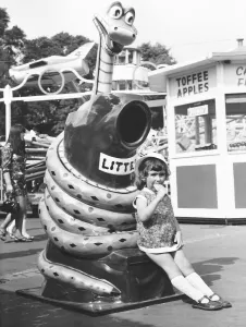 Three year old Christine Elliot from Harpenden hurries through her ice-lolly so that she Three year old Christine Elliot from Harpenden hurries through her ice-lolly so that she