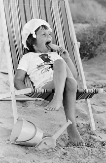 Four year old Joanna Weaver of Fordcombe, Kent enjoys an ice lolly as she sits in a deck Four year old Joanna Weaver of Fordcombe, Kent enjoys an ice lolly as she sits in a deck