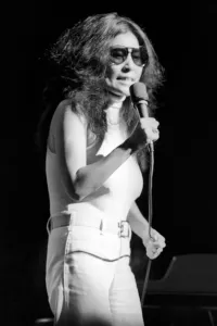 Yoko Ono singing in a charity concert in New York with her husband John Lennon Yoko Ono singing in a charity concert in New York with her husband John Lennon