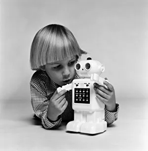 A young boy playing with a Computer48 toy robot. December 1980 A young boy playing with a Computer48 toy robot. December 1980