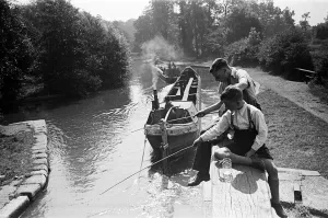 Young boys fishing on a canal near Watford, Hertfordshire. Circa 1945 Young boys fishing on a canal near Watford, Hertfordshire. Circa 1945