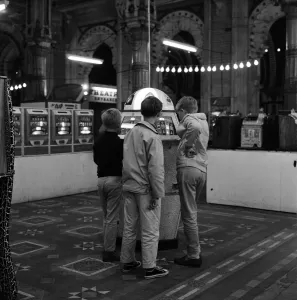 Three young boys pictured in the amusement arcades. Scarborough, North Yorkshire Three young boys pictured in the amusement arcades. Scarborough, North Yorkshire