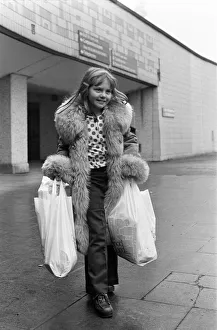 A Young Christmas shopper in Birmingham. 20th December 1975 A Young Christmas shopper in Birmingham. 20th December 1975