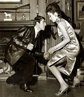 A young couple dancing the twist in their living room May 1963 A young couple dancing the twist in their living room May 1963