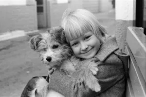 A young girl holding her puppy, Scamp. 2nd January 1980 A young girl holding her puppy, Scamp. 2nd January 1980