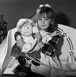 A young girl plays with her Cabbage Patch Dolls. 5th November 1987 A young girl plays with her Cabbage Patch Dolls. 5th November 1987
