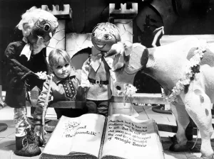 A young girl visiting a christmas grotto in Teesside, surrounded by characters from Jack A young girl visiting a christmas grotto in Teesside, surrounded by characters from Jack