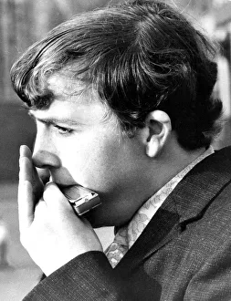A young man playing the Harmonica in September 1971 A young man playing the Harmonica in September 1971
