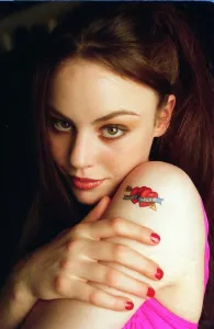 Young model with a tatoo saying True Love with two hearts and an arrow Young model with a tatoo saying True Love with two hearts and an arrow
