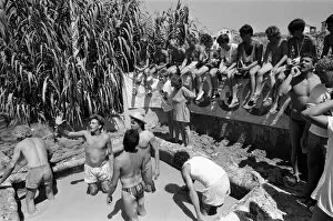 Images Dated 1st August 1986: Young people on holiday in Corfu on a Club 18-30 holiday. Young people wrestle in the mud