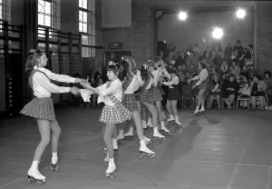 Young roller skaters are taking part in a roller skaters variety show Young roller skaters are taking part in a roller skaters variety show